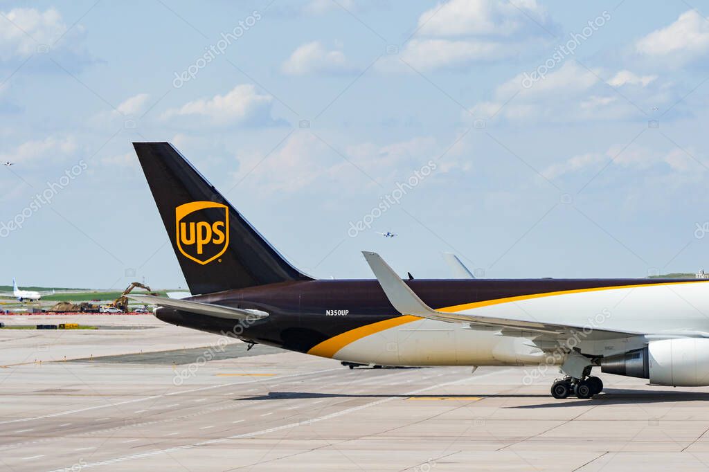 Denver, Colorado, USA - 5 June 2025: Tail fin of a Boeing 767 cargo jet (registration N350UP) operated by United Parcel Service UPS taxiing after landing at Denver International Airport.