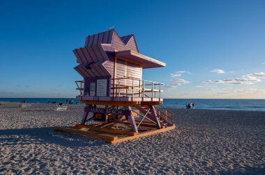 Miami Beach, Florida - January 7, 2023 - Colorful lifeguard station on South Beach on clear cloudless sunny morning.
