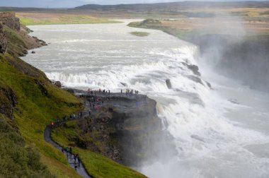 Gullfoss - Golden Falls - on Icelands Golden Circle route near Reykjavik under autumn cloudscape. clipart