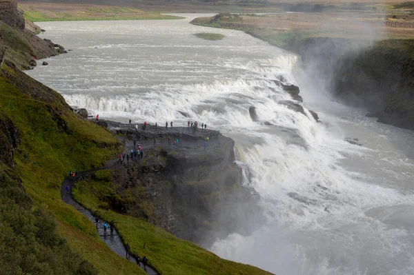 Gullfoss - Golden Falls - on Icelands Golden Circle route near Reykjavik under autumn cloudscape.