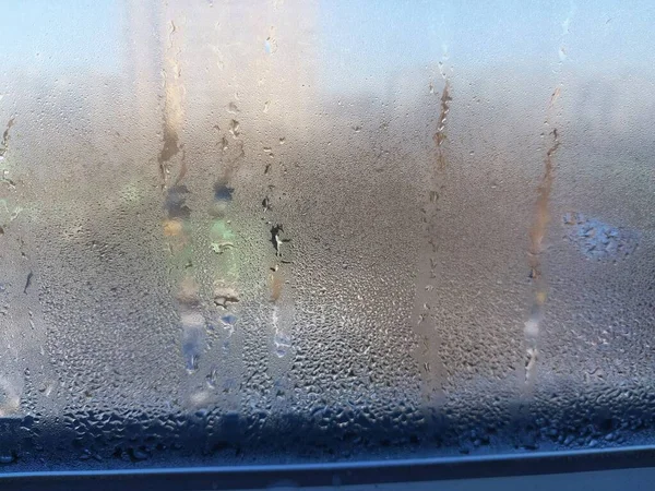 Window covered with frozen drops of the condensate water