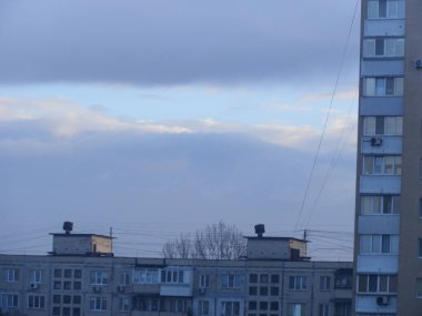 Morning winter fog hangs over a the city