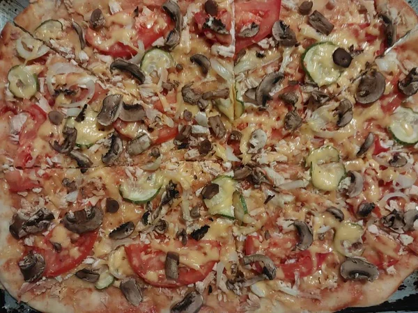 Homemade pizza baked by the hand