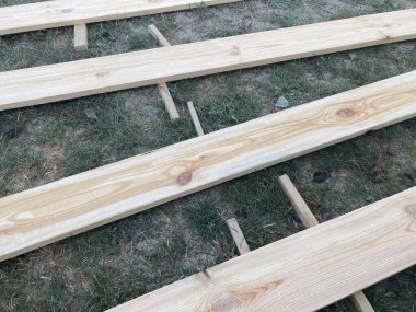 Preparing lumber for priming and the  painting clipart