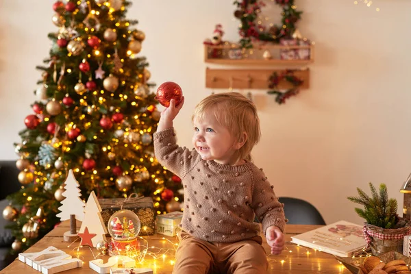 Santa Baby Christmas Tree Background Happy New Year Child Knitted — Stock Photo, Image