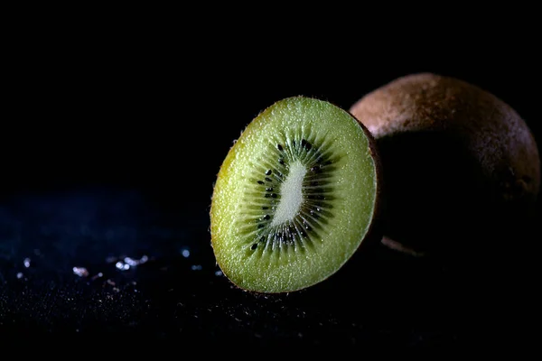 kiwi fruit on black background