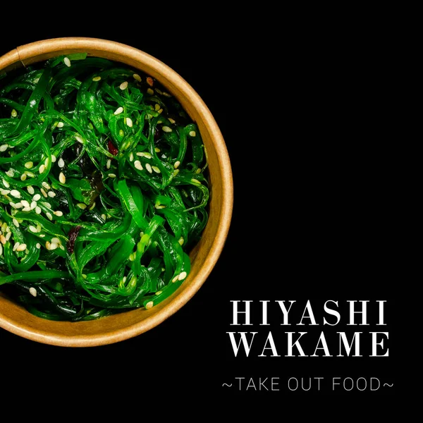 Close up to Hiyashi Wakame Chuka Salad served in delivery box isolated on black background. Ready square advertising banner with text and copy space. Japanese seaweed salad with sesame seeds.