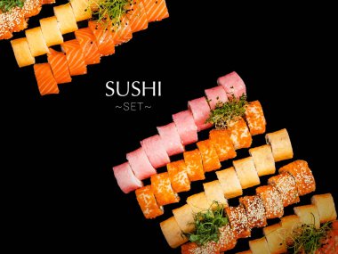 Large Set of different types of sushi rolls. A lot of sushi isolated on black background with text and copy space. Ready square restaurant menu banner. Assortment of dragon rolls with greens on top