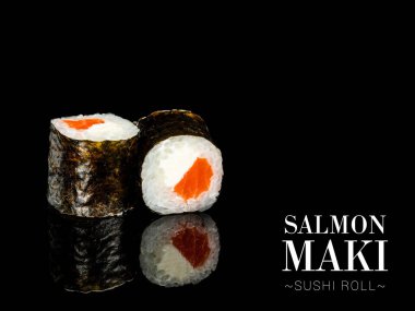 Close up to Maki sushi roll pieces with mirror reflection on black background. Sushi roll with salmon, cream cheese and nori seaweed on top. Ready menu advertising banner with text and copy space.