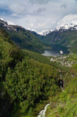 Beautiful view of the Geiranger Fjord and the town of Geiranger from the Adlerkehre with a cruise ship at anchor