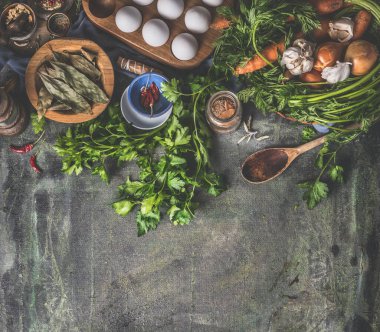 Dark rustic food background. Herbs and seasoning with wooden vintage kitchen utensils and ingredients. Top view. Copy space. Flat lay. Home still life. Vegan and vegetarian eating. Cooking preparation