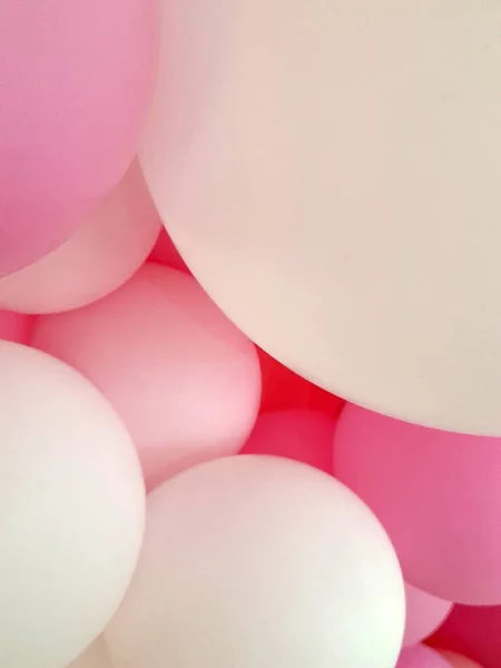 Balloons. White and pink balloons. Festive background of balloons
