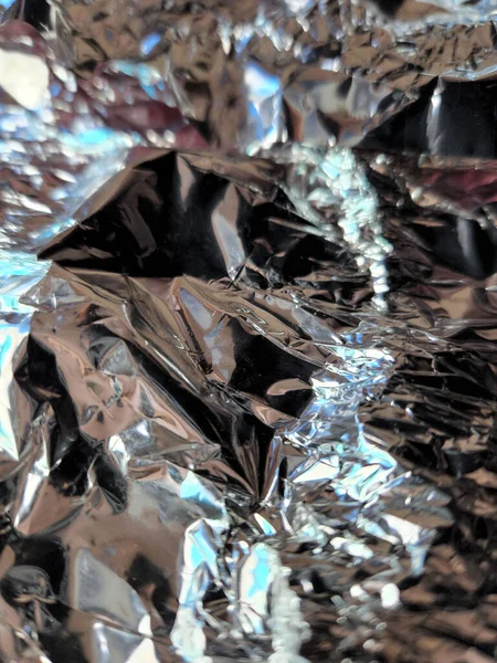 Metallic surface. Wrinkled foil. Foil. Metallic background