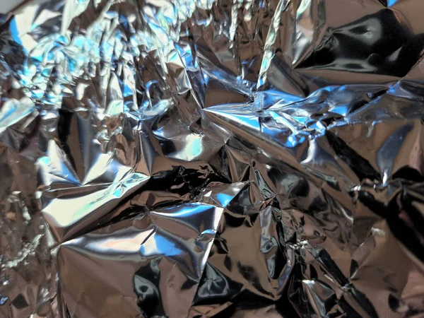 Metallic surface. Wrinkled foil. Foil. Metallic background
