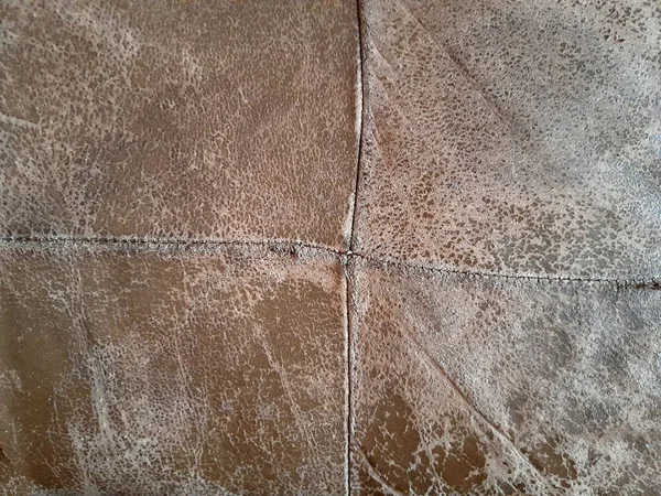 Dermantin. Worn leather patches. Antique leather upholstery. Worn leather texture