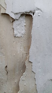 Beyaz boya. Eski kabuk soyma badanası. Soyulmuş alçı duvar
