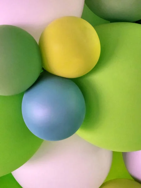 Festive background from balloons. Green balloons. Abstract background