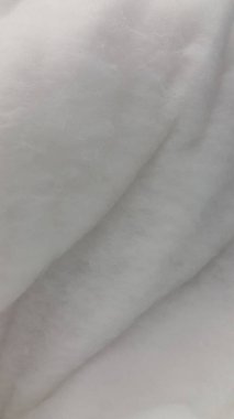 Yumuşak bir doku. Yumuşak beyaz kabarık yüzey. Bulanık arkaplan