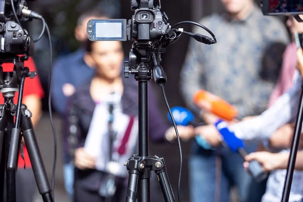 Filming media event or press conference with a video camera