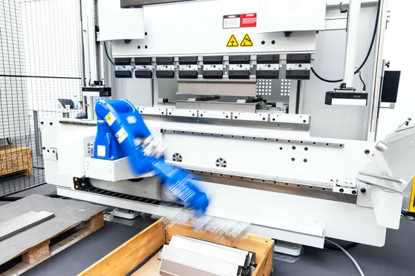 stock image Blurred motion of robot arm in factory