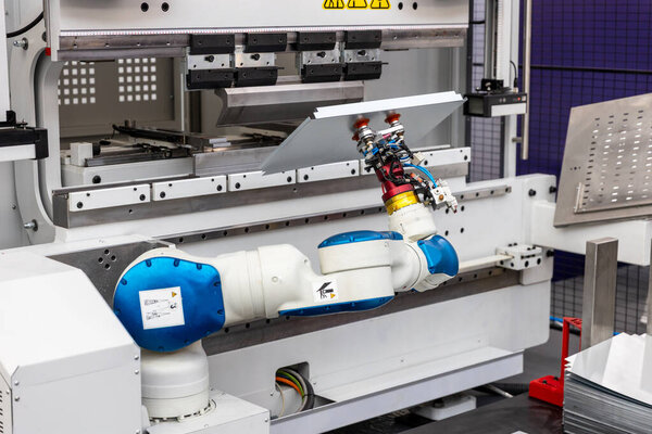 Robotic manipulator working on CNC press brake in smart sheet metal factory