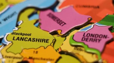 England Map Puzzle Blocks with Great Britain  Cities. Close-Up Video Background, Dolly Footage.