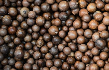 macadamia nuts texture background, fresh natural shelled raw macadamia nuts in a full frame, close up pile of roasted macadamia nut - top view