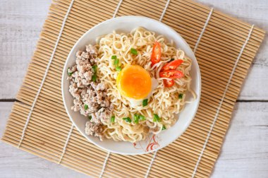 noodles plate with egg minced pork vegetable spring onion celery and chili on table food , instant noodles cooking tasty eating with bowl noodle - top view