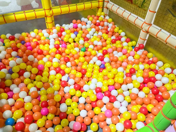 Children playground indoor at amusement park with colorful balls for playing, Inside the beautiful kids playground ball colored plastic of game room