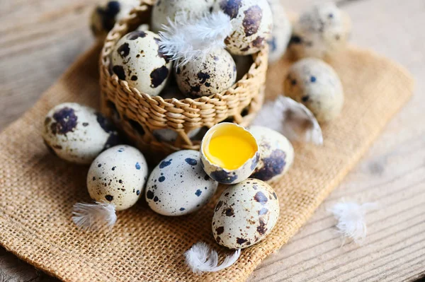 quail eggs on basket, fresh quail eggs on wooden table background, raw eggs with peel egg shell