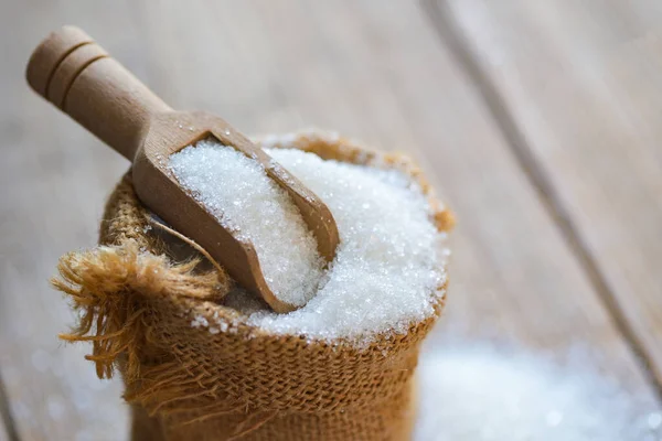 white sugar for food and sweets dessert candy heap of sweet sugar crystalline granulated, Sugar on sack and wooden background