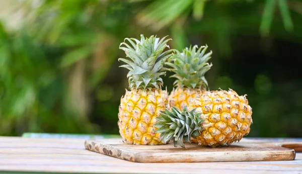 stock image pineapple wooden cutting board for food fruit ripe pineapple on nature background, fresh pineapple tropical fruits summer