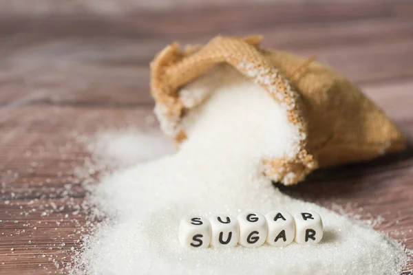 white sugar for food and sweets dessert candy heap of sweet sugar crystalline granulated, Sugar on sack and wooden background
