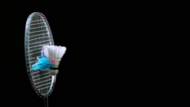 Super Slow Motion Shot Hitting Badminton Shellecock Containing Neon Powder — стоковое видео