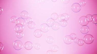 Pembe Arkaplanda Uçan Renkli Sabun Köpüklerinin Süper Yavaş Çekimi, 1000 fps. 4K 'da Yüksek Hız Sinema Kamerası ile çekildi..