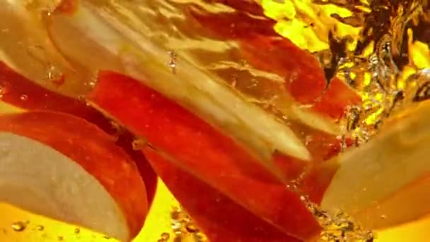 Super Slow Motion Shot Red Apple Slices Falling Juice Vortex — Stock Video