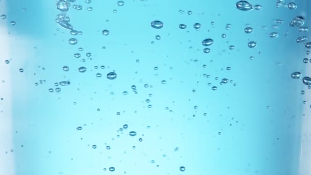 Super Slow Motion Shot Air Bubbles Rising Glass Light Blue — стоковое видео