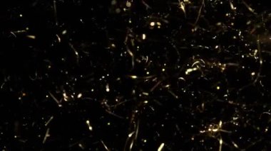 Süper Yavaş Çekim Altın Işıldayan Konfeti Arkaplanı 1000fps. 4K Çözünürlükte Yüksek Hız Sinema Kamerası ile Çekim.