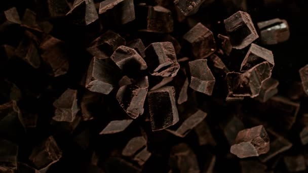 Super Slow Motion Shot Raw Chocolate Chunks Being Exploded Camera — Stock video