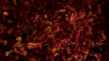 Süper Yavaş Çekim Kurutulmuş Kırmızı Chili Biber Patlaması Kara Arkaplan 'da 300 fps' de. 4K Çözünürlükte Yüksek Hız Sinema Kamerasında Çekim.