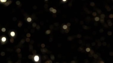 Süper Yavaş Çekim Altın Parıldayan Bokeh Parçacıkları 'nın 1000fps yükseklikte. 4K Çözünürlükte Yüksek Hız Sinema Kamerası ile Çekim.