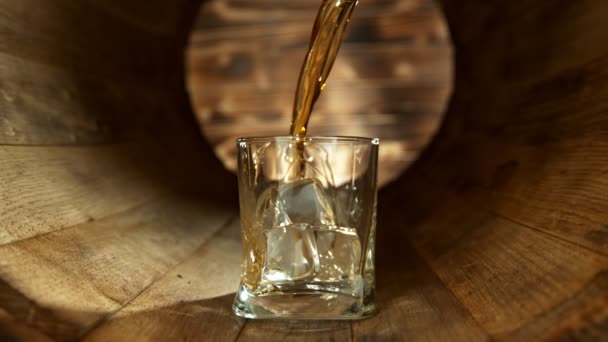 Super Slow Motion Shot Pouring Whiskey Glass Ice Cubes Wooden — Stok Video