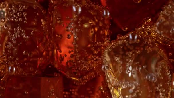 Super Slow Motion Detail Shot Fizzing Cola Lemonade Floating Ice — Stock video