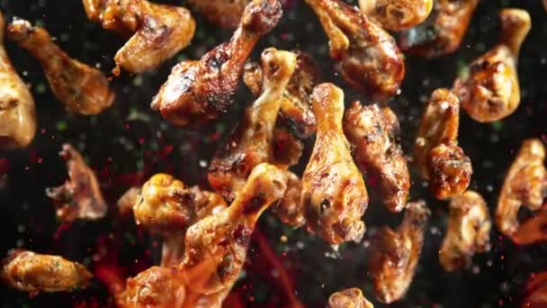 Super Slow Motion Shot Grilled Spicy Chicken Wings Drumsticks Flying — Stock Video