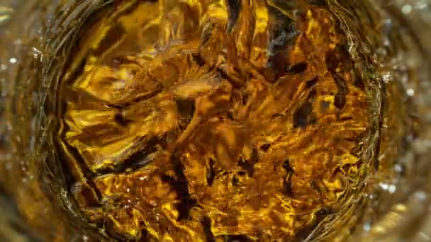 Super Slow Motion Detail Shot Golden Alcohol Liquid Στροβιλίζεται Γυάλινο — Αρχείο Βίντεο