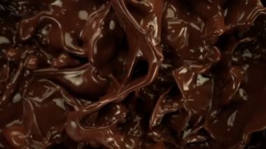 Su Sıçratma 'nın Süper Yavaş Çekimi Eritilmiş Çikolata Arka planı, 1000 fps' de. 4K Çözünürlükte Yüksek Hız Sinema Kamerası ile Çekim.