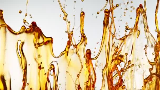 Super Slow Motion Shot Spelling Golden Oil White Foundation 1000Fps — стоковое видео