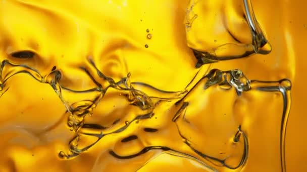 Super Slow Motion Shot Splashing Golden Oil Waves Prędkością 1000 — Wideo stockowe