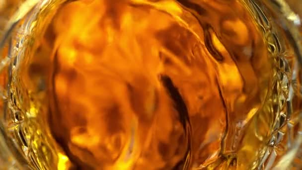 Super Slow Motion Detail Shot Von Golden Alcohol Liquid Swirling — Stockvideo