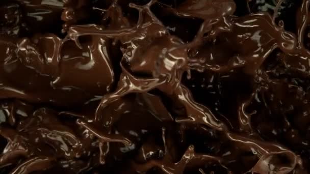 超级慢镜头飞溅融化巧克力背景1000 Fps 用4K解像度的高速电影摄影机拍摄 — 图库视频影像